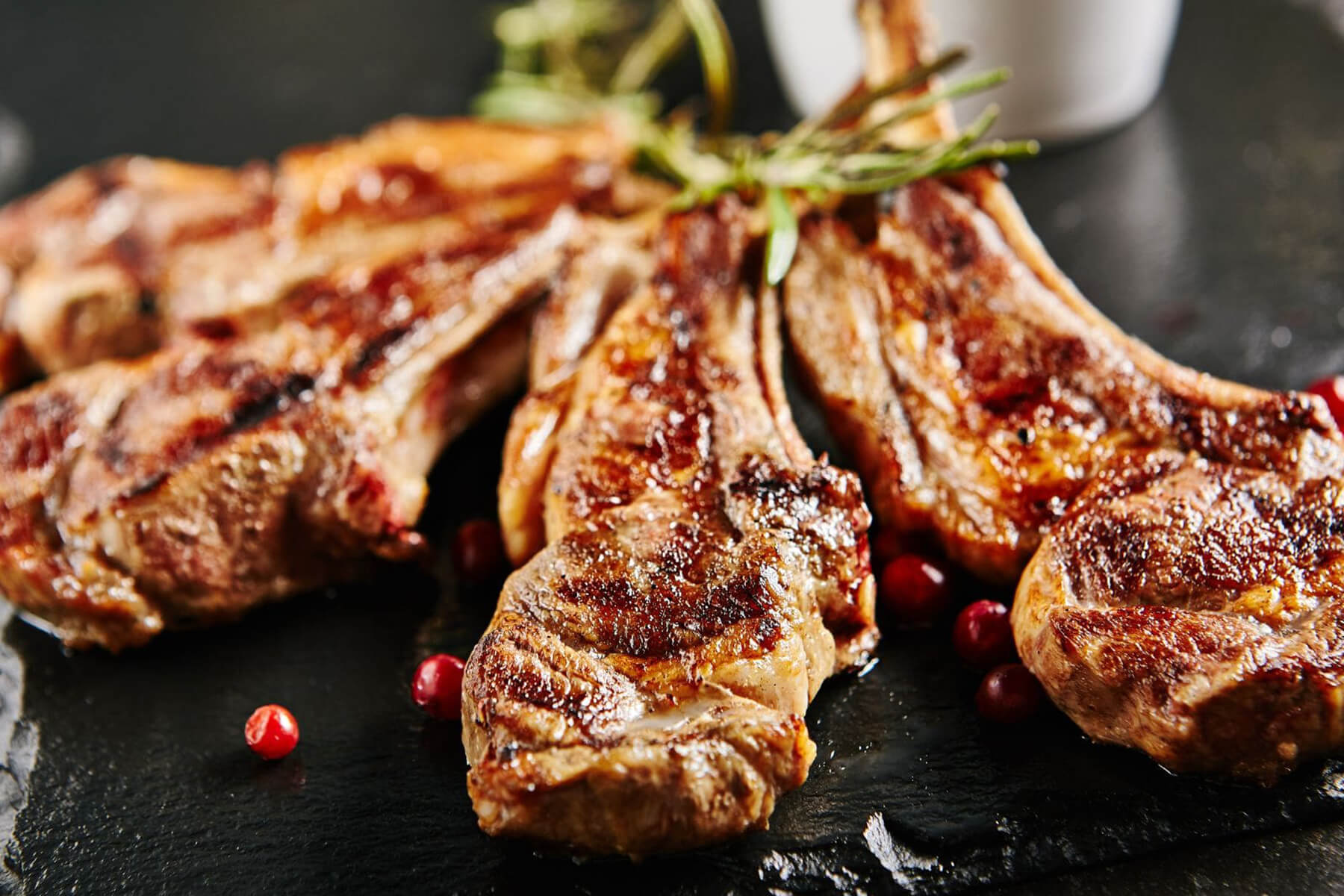 Grilled lamb over vine shoots